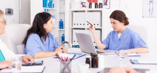 Three nurses having a meeting